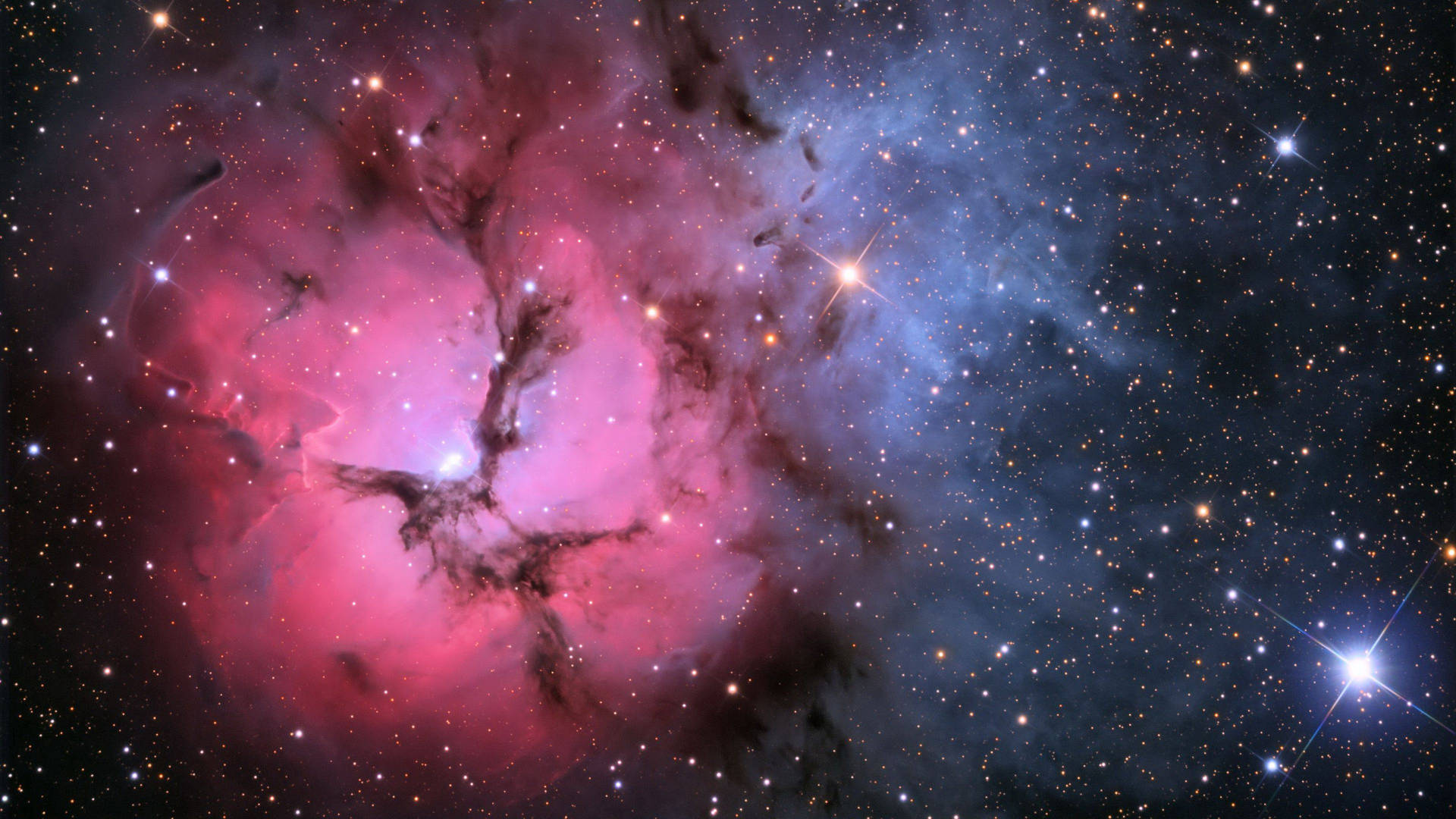 A beautiful view of a pink and purple galaxy Wallpaper